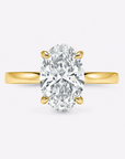 hidden halo oval cut gold engagement ring
