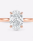 hidden halo oval cut gold engagement ring