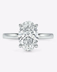 hidden halo oval cut gold engagement ring