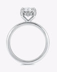 hidden halo oval cut gold engagement ring